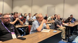 Attendees listen as Megan Killion presents on MSP AI value at MSP Summit 2026.